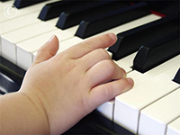 small hand on piano